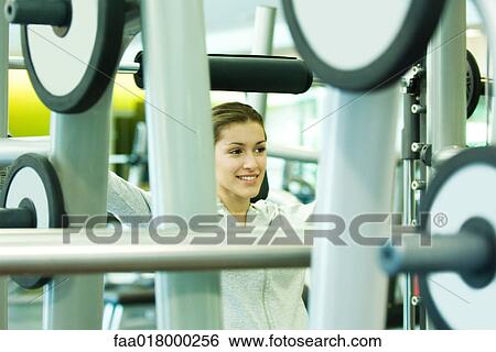 Stock Photograph - Woman lifting weights. Fotosearch