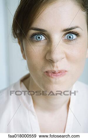Woman making face, close-up, portrait View Large Photo Image Stock Photo - Woman making face, close-up, portrait. Fotosearch
