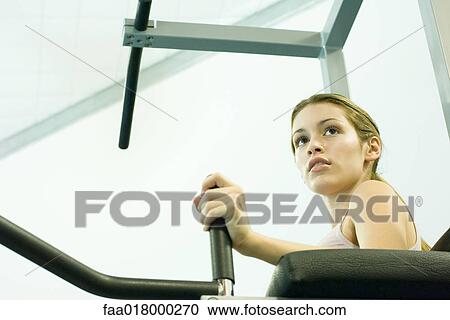 Woman using weight machine View Large Photo Image Stock Image - Woman using weight machine. Fotosearch