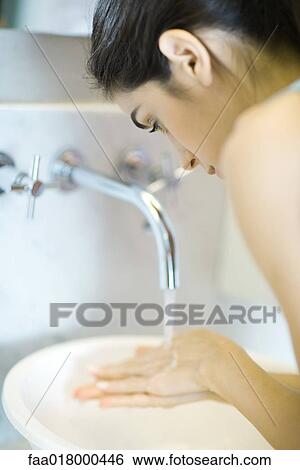 Stock Photograph - Woman washing hands. Fotosearch