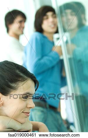 Young friends, focus on teen girl in foreground View Large Photo Image Stock Image - Young friends, focus on teen girl in foreground. Fotosearch