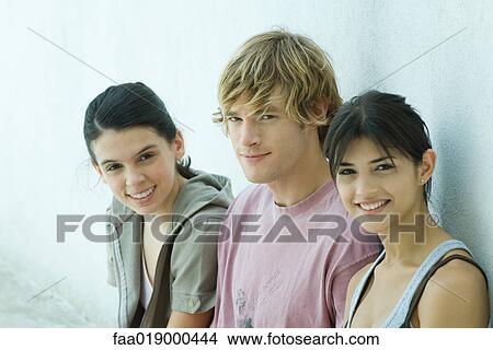 Young friends, smiling at camera, portrait View Large Photo Image Picture - Young friends, smiling at camera, portrait. Fotosearch