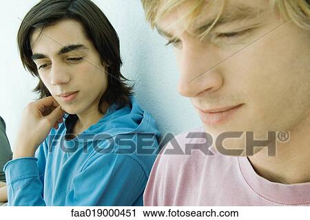 Young man and teen boy, close-up View Large Photo Image Stock Image - Young man and teen boy, close-up. Fotosearch