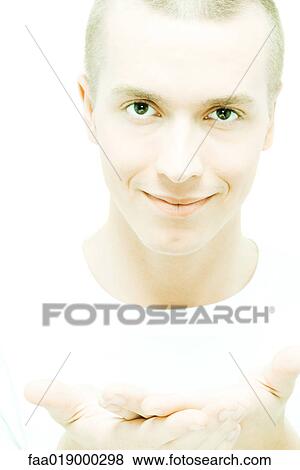 Young man holding up open palms View Large Photo Image Stock Photo - Young man holding up open palms. Fotosearch