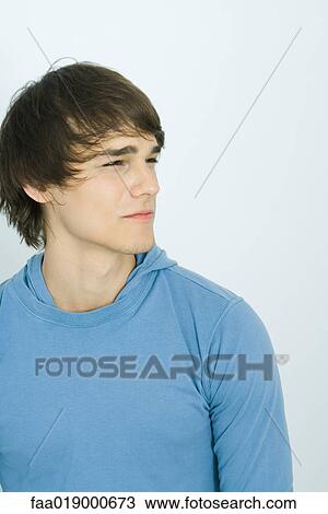 Young man looking away, portrait View Large Photo Image Stock Image - Young man looking away, portrait. Fotosearch