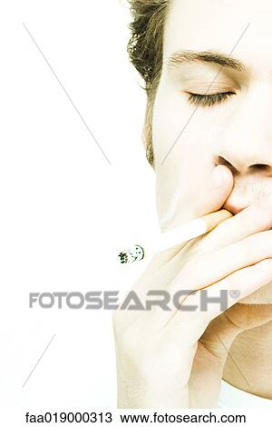 Young man smoking cigarette View Large Photo Image Stock Image - Young man smoking cigarette. Fotosearch