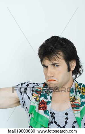 Young man wearing lipstick and scarf around neck, pouting, portrait View Large Photo Image Stock Image - Young man wearing lipstick and scarf around neck, pouting, portrait. Fotosearch