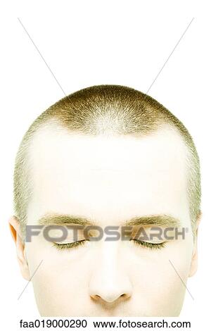 Young man with shaved head, eyes closed, close-up View Large Photo Image Stock Image - Young man with shaved head, eyes closed, close-up. Fotosearch