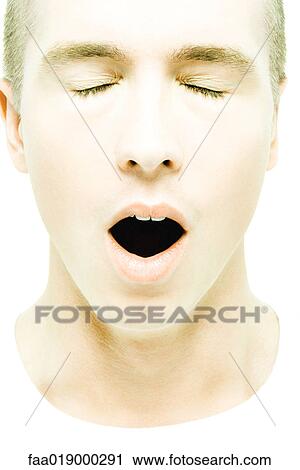 Young man yawning, eyes closed View Large Photo Image Stock Image - Young man yawning, eyes closed. Fotosearch