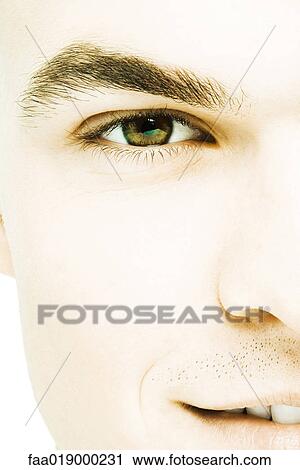 Young man's face, extreme close-up View Large Photo Image Stock Image - Young man's face, extreme close-up. Fotosearch