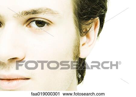 Young man's face, extreme close-up View Large Photo Image Stock Image - Young man's face, extreme close-up. Fotosearch