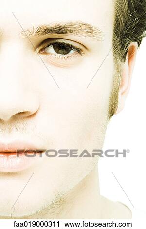 Young man's face, extreme close-up View Large Photo Image Stock Image - Young man's face, extreme close-up. Fotosearch