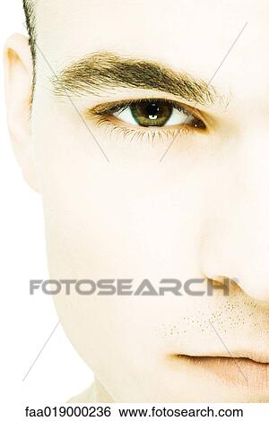 Young man's face, extreme close-up View Large Photo Image Stock Photograph - Young man's face, extreme close-up. Fotosearch