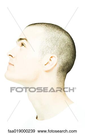 Stock Photo - Young man's head, looking up, profile. Fotosearch