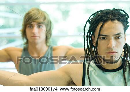 Young men with arms out in exercise class View Large Photo Image Picture - Young men with arms out in exercise class. Fotosearch