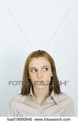 Young woman, glancing to the side, portrait View Large Photo Image Stock Photography - Young woman, glancing to the side, portrait. Fotosearch