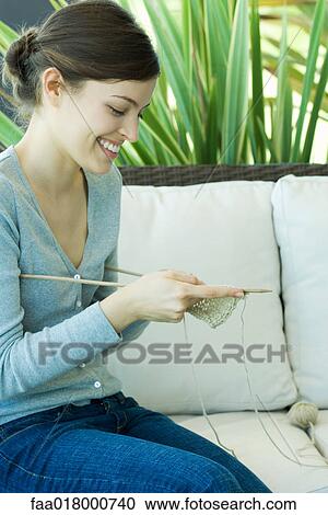 Young woman knitting View Large Photo Image Stock Image - Young woman knitting. Fotosearch