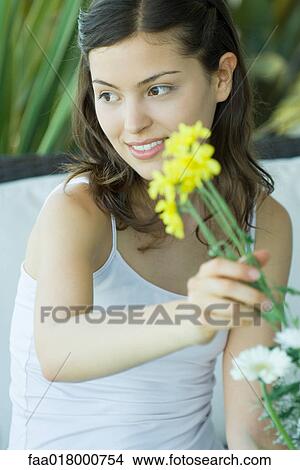 Young woman making fresh flower arrangement View Large Photo Image Picture - Young woman making fresh flower arrangement. Fotosearch