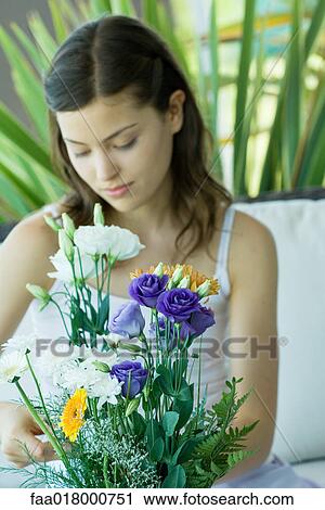 Young woman making fresh flower arrangement View Large Photo Image Stock Image - Young woman making fresh flower arrangement. Fotosearch