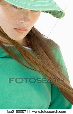 Young woman wearing sun hat, close-up View Large Photo Image Stock Image - Young woman wearing sun hat, close-up . Fotosearch