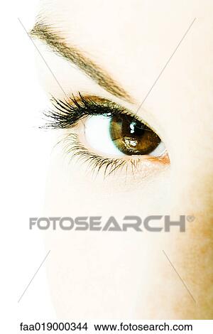 Picture - Young woman's eye, extreme close-up. Fotosearch