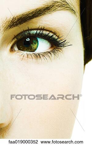 Stock Image - Young woman's eye, extreme close-up. Fotosearch