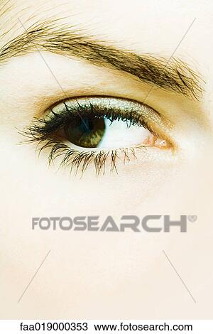 Stock Image - Young woman's eye, extreme close-up. Fotosearch