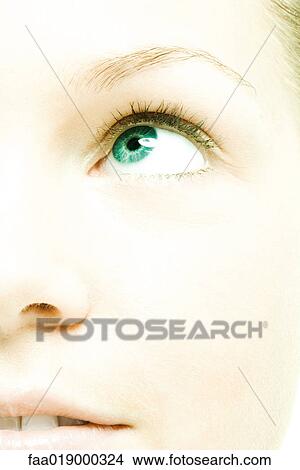Picture - Young woman's face, extreme close-up. Fotosearch