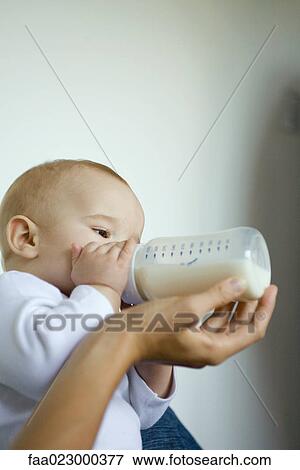 Baby drinking from bottle View Large Photo Image Stock Photo - Baby drinking from bottle. Fotosearch