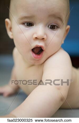 Baby lying on floor, mouth wide open View Large Photo Image Stock Photography - Baby lying on floor, mouth wide open. Fotosearch