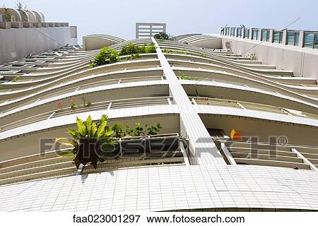 Balconies on high rise apartment building, low angle view View Large Photo Image Stock Photo - Balconies on high rise apartment building, low angle view. Fotosearch