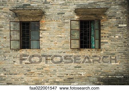 Barred windows in side of building View Large Photo Image Stock Photo - Barred windows in side of building. Fotosearch