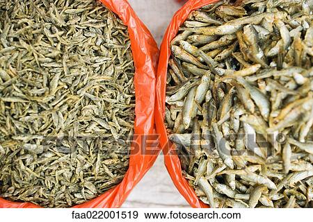 Stock Photo - Bowls of dried fish, high angle view. Fotosearch