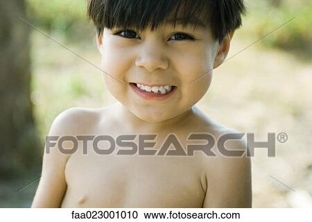 Boy smiling at camera, portrait View Large Photo Image Stock Image - Boy smiling at camera, portrait. Fotosearch