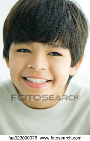 Boy smiling, looking away, portrait View Large Photo Image Stock Photo - Boy smiling, looking away, portrait. Fotosearch