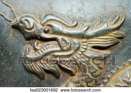 Bronze dragon in relief, close-up View Large Photo Image Stock Image - Bronze dragon in relief, close-up. Fotosearch