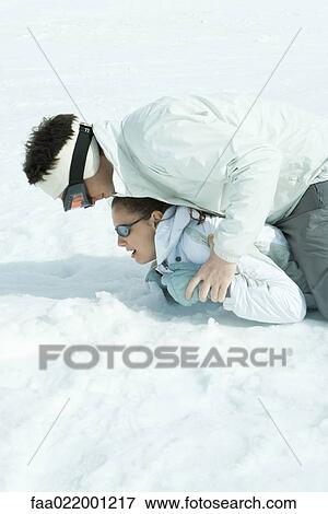 Brother and sister playing around in snow, one on top of the other View Large Photo Image Stock Photo - Brother and sister playing around in snow, one on top of the other. Fotosearch