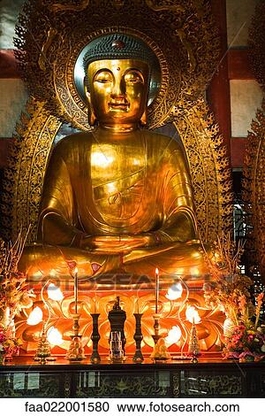 Stock Image - Buddha in temple. Fotosearch