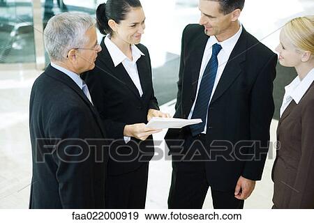 Business associates standing together, smiling, high angle view View Large Photo Image Stock Photo - Business associates standing together, smiling, high angle view. Fotosearch