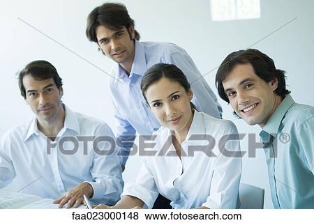 Business team, smiling at camera, portrait View Large Photo Image Stock Photo - Business team, smiling at camera, portrait. Fotosearch