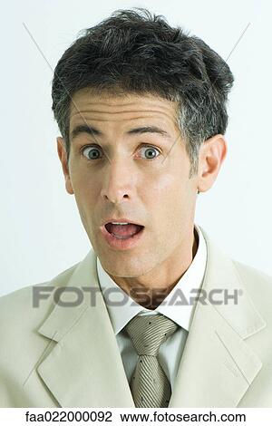 Businessman making surprised face, portrait View Large Photo Image Stock Image - Businessman making surprised face, portrait. Fotosearch