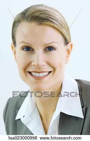 Businesswoman smiling at camera, portrait View Large Photo Image Stock Photograph - Businesswoman smiling at camera, portrait. Fotosearch