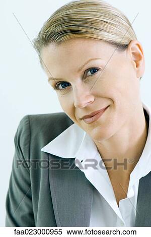 Businesswoman smiling at camera, portrait View Large Photo Image Stock Photography - Businesswoman smiling at camera, portrait. Fotosearch