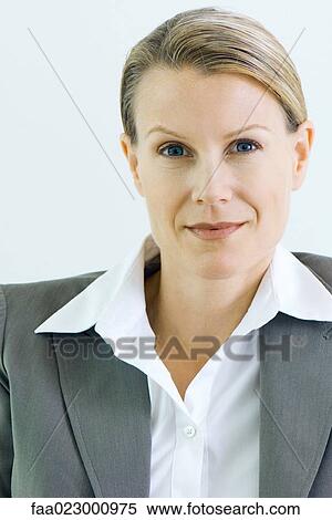 Businesswoman smiling at camera, portrait View Large Photo Image Stock Photography - Businesswoman smiling at camera, portrait. Fotosearch