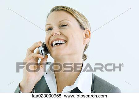 Stock Photography - Businesswoman using cell phone, smiling, head back. Fotosearch