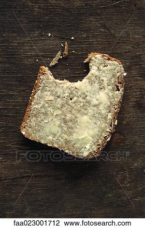 Buttered bread with bite missing View Large Photo Image Stock Image - Buttered bread with bite missing. Fotosearch