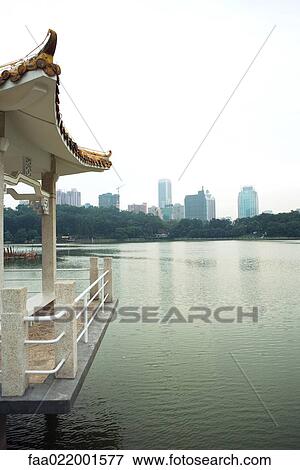 Stock Photo - China, Guangdong province, gazebo on edge of water. Fotosearch