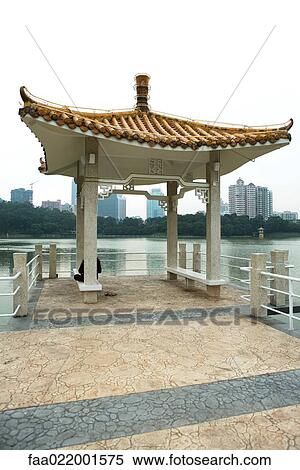 Stock Photography - China, Guangdong province, gazebo on edge of water. Fotosearch