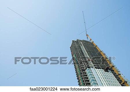 China, Guangdong Province, Guangzhou, high rise under construction View Large Photo Image Picture - China, Guangdong Province, Guangzhou, high rise under construction. Fotosearch
