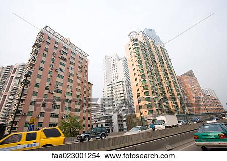 China, Guangdong Province, Guangzhou, street and high rises View Large Photo Image Picture - China, Guangdong Province, Guangzhou, street and high rises. Fotosearch